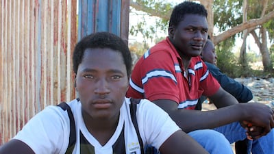 Migrants pose for a photograph on the street, after being rescued by the Libyan coast guard, in Misrata, Libya. Reuters