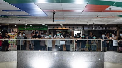 Protesters gather outside the office of pro-Beijing government lawmaker Junius Ho in Hong Kong's Tsuen Wan district. AFP