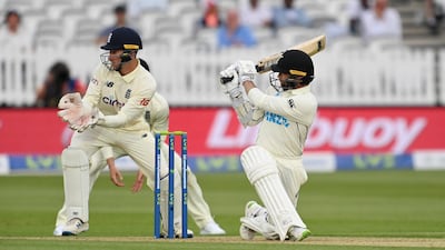 Devon Conway of New Zealand sweeps during day one of the first Test. Getty