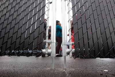 In this file photo taken on August 05, 2017, refugees who crossed the Canada/US border illegally wait in a temporary detention center in Blackpool, Quebec. AFP