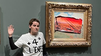 An environmental activist was detained after sticking a protest sign on a Monet painting, calling for action to protect food supplies from further damage to the climate. AP