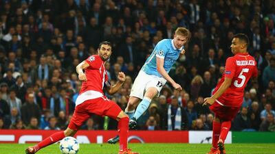 Kevin de Bruyne of Manchester City scores his team’s winning goal in added time on Wednesday in a 2-1 Champions League victory over Sevilla. Richard Heathcote / Getty Images