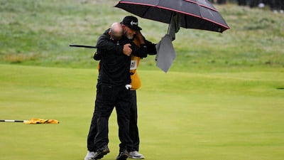Brian Harman celebrates his victory with Caddie Scott Tway. Getty