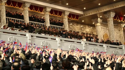 North Korean leader Kim Jong-un, centre, attends a military parade marking the ruling party congress. KCNA / AP