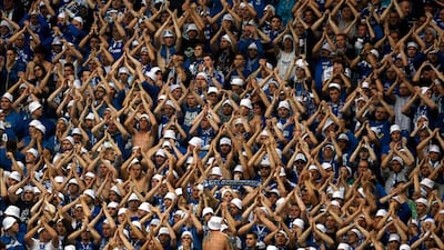 Schalke 04's supporters celebrate a goal against Borussia Dortmund during the German first division Bundesliga soccer match in Dortmund. Ina Fassbender / Reuters