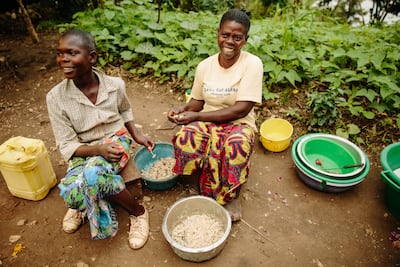 Toyota Mksiyura, right, from South Kivu, Democratic Republic of the Congo, who suffers from severe swelling in her feet caused by lymphatic filariasis, with her daughter. Photo: End Fund