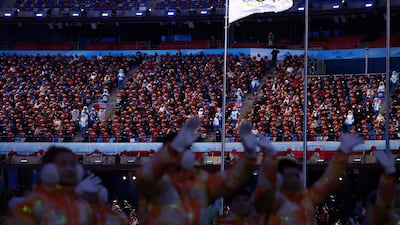 Spectators watch the closing ceremony on Sunday. Reuters