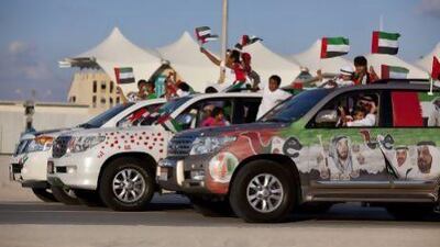 People join in celebration and show off their decorated cars during the Spirit of Union Parade at Yas Island in 2011. Silvia Razgova/The National