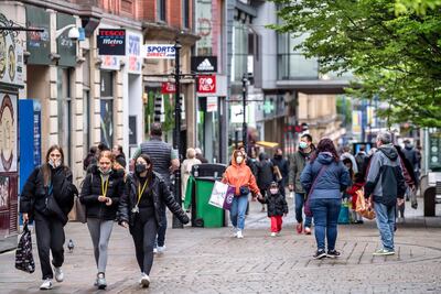 Shoppers on Market Street in Manchester, which saw its footfall slump during the pandemic. Darren Robinson Photography