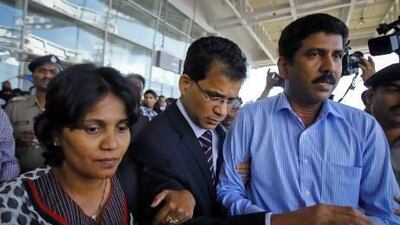 Jacintha Saldanha's widower Ben Barboza (centre) arrives at the airport to attend the funeral of his wife in Mangalore.