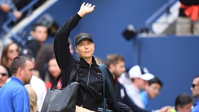 Maria Sharapova waves to the crowd after losing to Anastasija Sevastova in the US Open fourth round on Sunday. Eduardo Munoz Alvarez / AFP