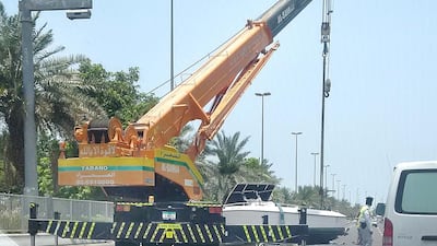 Traffic queued up along the Corniche on Monday after a pleasureboat came off its trailer. Courtesy Photo