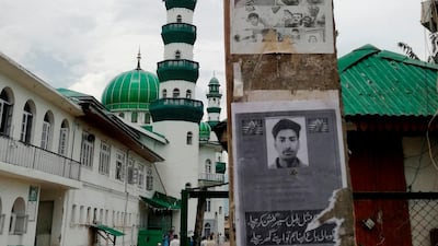 A poster of Kashmiri youth Usiab Ahmad, who drowned on August 5, allegedly after an encounter with Indian government forces near the Asar Shareef Jenab Saheb Mosque in Srinagar. Three deaths have been claimed by Kashmiri familes in the latest round of unrest in the region, but Indian authorities have not acknowledged any fatalities. AFP