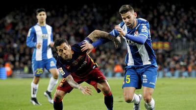 Espanyol's defender Victor Alvarez, right, fights for the ball with Brazilian defender Dani Alves, left, of Barcelona during their their Copa del Rey first leg match at Camp Nou stadium in Barcelona, Catalonia, Spain on 25 January 2016. EPA/ALEJANDRO GARCIA
