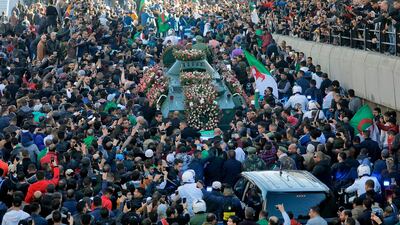 Thousands of Algerians gathered on Wednesday for the funeral procession of the country’s powerful army chief. AFP