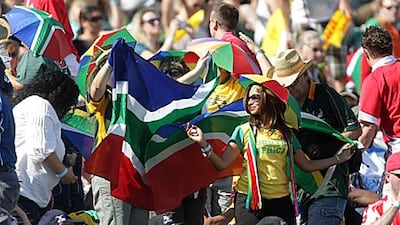 South Africa fans enjoy the party action in the packed stands at the Dubai Sevens.