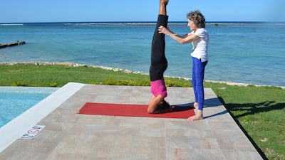 Tao Porchon-Lynch teaches Shoulder Stand in Montego Bay, Jamaica. Photo by Teresa Kay-Aba Kennedy
