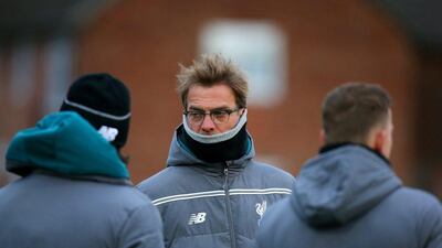 Jurgen Klopp, Manager of Liverpool speaks with members of his staff during a training session ahead of the Uefa Europa League round of 16 first leg match between Liverpool and Manchester United at Melwood Training Ground on March 9, 2016 in Liverpool, United Kingdom. (Photo by Dave Thompson/Getty Images)