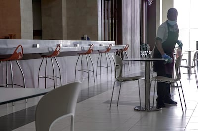 The Abu Dhabi Department of Economic Development outlines six steps that employers must adhere to during the return to work phase. Victor Besa / The National