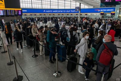 Passenger queues at the British Airways desk at Heathrow Airport over Easter. Bloomberg