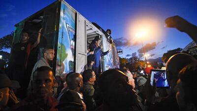 Venezuelan President Nicolas Maduro, centre, speaks to supporters outside the Miraflores presidential palace in Caracas. Juan Bareeto / AFP Photo