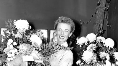 Cloris Leachman in her dressing room at the Majestic Theatre with the flowers she received for playing the lead in 'South Pacific' on Broadway in New York, 1952. AP