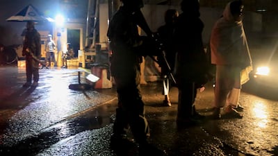Taliban troops gather at the scene of a bomb blast outside the Ministry of Foreign Affairs in Kabul, Afghanistan. EPA