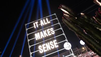 Outside, large neon signs lit the way around the outdoor space. Courtesy Hermès