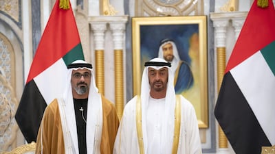 Sheikh Mohamed bin Zayed stands for a photograph with Major General Sheikh Khaled bin Mohamed bin Zayed during the swearing-in ceremony. Ministry of Presidential Affairs