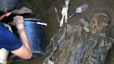 Workers from the Spanish organisation Association for the Recuperation of Historic Memory exhuming the remains of four bodies of the same family executed during the Spanish civil war in the As Pontes, northern Spain.