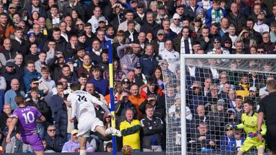 Tottenham Hotspur's Harry Kane, left, scores against Leeds United at Elland Road on Saturday. AFP