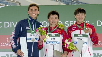 Qiu Bo, centre, poses with his gold medal from the men's 10m platform with silver medallist Tom Daley, left, and bronze medallist Yang Jin, right. Photo courtesy: Fina World Diving Series