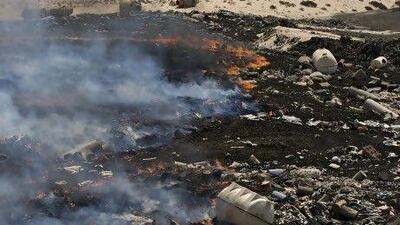 A two-day-old fire continued to burn late Saturday afternoon at the Jebel Ali Waste Treatment Complex.