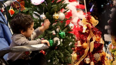 People shop for Christmas decorations at Lulu in Al Wahda Mall in Abu Dhabi. Ravindranath K / The National