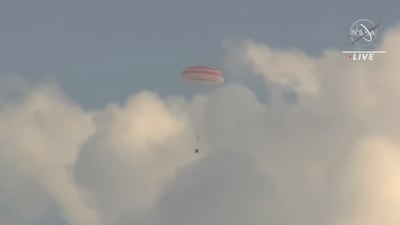 The capsule parachutes in to land in Kazakhstan. Photo: Nasa