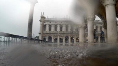 Pouring rain adds discomfort in Venice. Luca Bruno / AP Photo