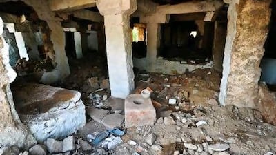 A derelict building in the marketplace, where modern structures are being removed to make way for the restoration of stone-built pavilions.