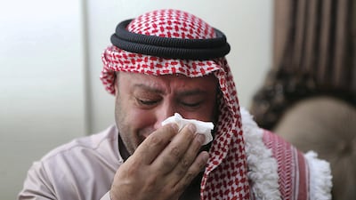 Zakaria Al Jawawdeh, whose son Mohammed was shot dead by a security guard at the Israeli embassy in Amman, cries at his home in the Jordanian capital. Salah Malkawi for The National