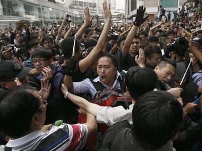 Pro-democracy protesters from the Occupy Central movement and anti-occupy protesters in the Central District of Hong Kong in 2014. Rolex Dela Pena / EPA