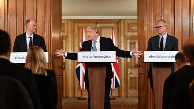 Boris Johnson, U.K. prime minister, center, speaks while Chris Whitty, U.K. chief medical officer, left, and Patrick Vallance, U.K. lead science adviser, listens during a daily coronavirus briefing inside number 10 Downing Street in London, U.K. Johnson said the U.K. can "turn the tide" on its burgeoning coronavirus outbreak within three months, as he said ministers will unveil measures to protect businesses and workers from the crisis. Getty Images