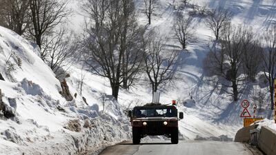 An Israeli military vehicle patrols on a road leading to the Mount Hermon resort, located at the intersection of the Israeli-Lebanese-Syrian border in the north of the Golan Heights. EPA
