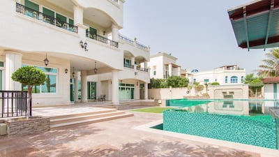 Outside, the property offers a perfectly manicured garden featuring a large infinity pool and Jacuzzi, BBQ area and outdoor kitchen. Courtesy Luxhabitat