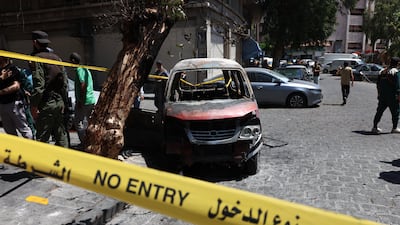 A burnt-out van at the site of a bomb blast in Damascus on Tuesday. Getty Images