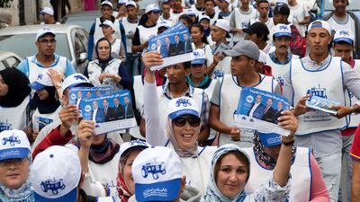 Supporters of Morocco's Party of Authenticity and Modernity (PAM) pass out campaign leaflets in the Moroccan capital , Rabat on October 5, 2016, ahead of the upcoming parliamentary election on October 7. Fadel Senna / AFP