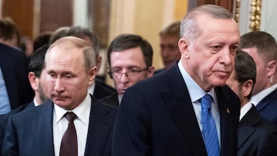 Russian President Vladimir Putin and Turkish President Reccep Tayyip Erdogan arrive for a news conference in March 2020. Reuters