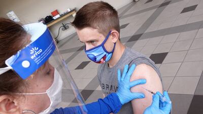 A student receives a dose of a Covid-19 vaccine at the University of Memphis in Tennessee. Reuters