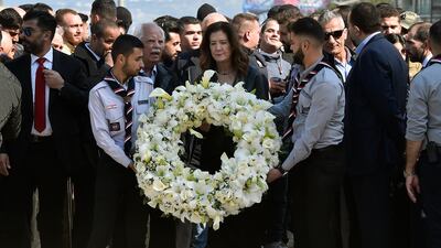 US Ambassador to Lebanon Dorothy Shea, centre, lays a wreath on Rafik Hariri's grave. EPA