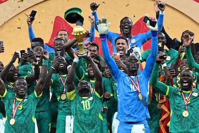 Senegal's Sadio Mane with teh Afcon trophy after the win over Morocco in Rabat on January 18. Senegal were on Tuesday stripped of the title. AFP