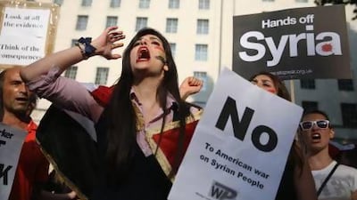 Protesters gather on Whitehall outside Downing Street to campaign for no international military intervention in the ongoing conflict in Syria.