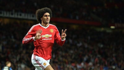 Manchester United's Marouane Fellaini celebrates after scoring their third goal to finish the Champions League play-off round first leg tie against Club Brugge on Tuesday night 3-1 up. Peter Powell / EPA